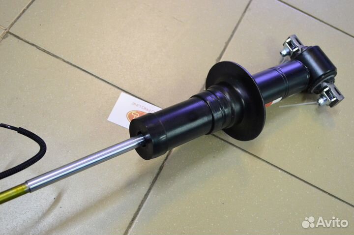 Амортизатор передний Cadillac Escalade 4 с 2015-19