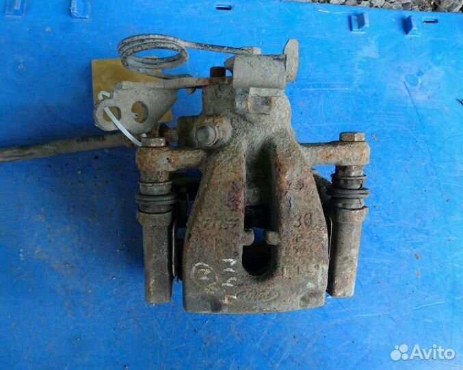 Суппорт тормозной задний левый на Форд Мондео 4