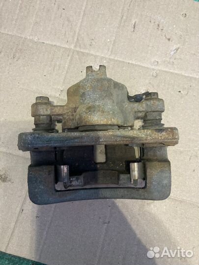 Суппорт тормозной задний левый Kia Cerato 09-2013Г