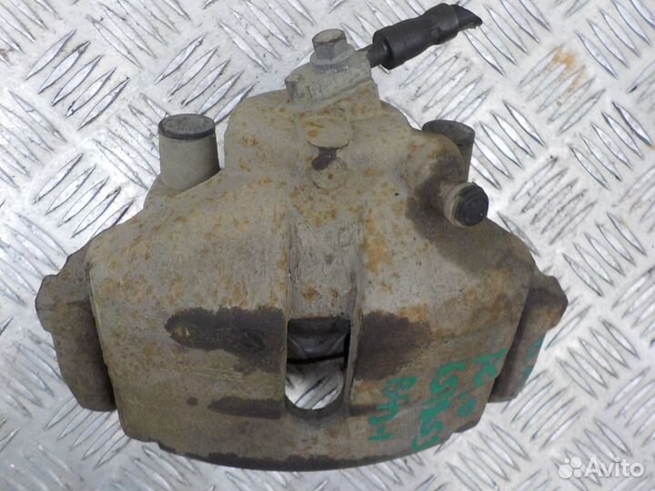 Суппорт тормозной передний левый на Volkswagen Pol