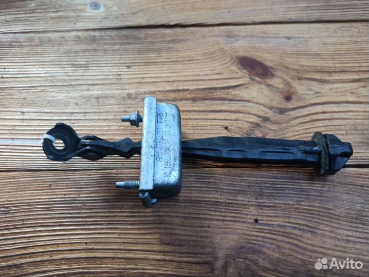 Ограничитель двери задний левый Opel Astra J