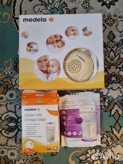 Молокоотсос medela электрический