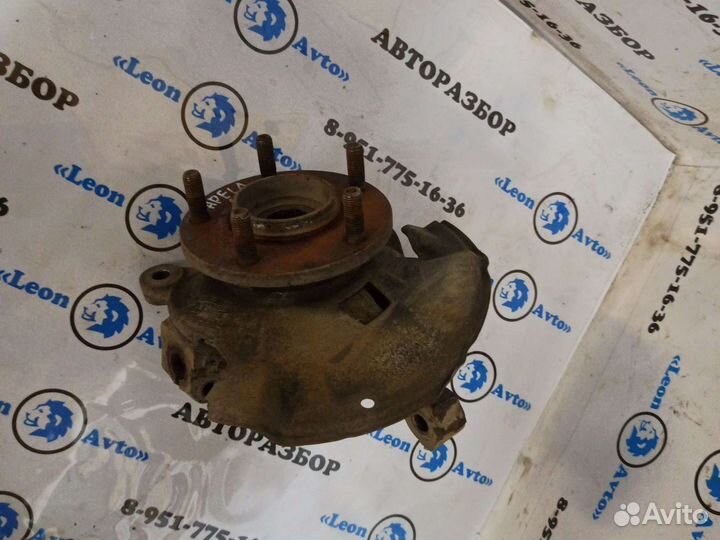 Кулак поворотный левый Mazda Capella GF