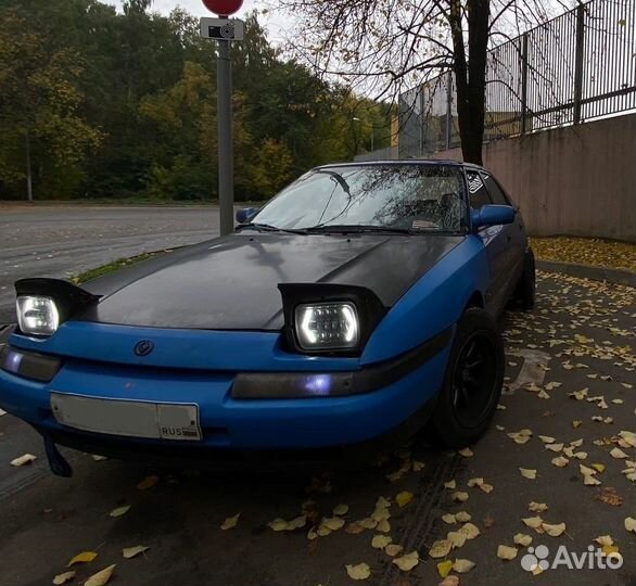 В разборе слепая Mazda 323f BG