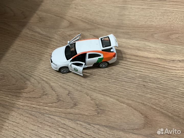 Автомобиль каршеринг Skoda Rapid игрушка