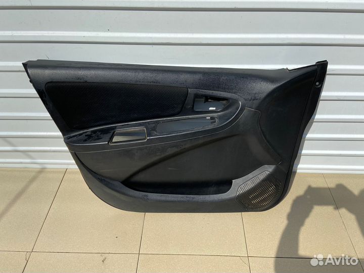 Обшивка двери передняя левая Geely мк