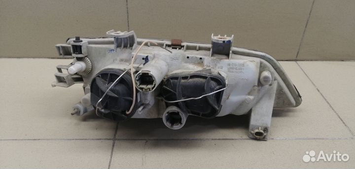 Фара левая Primera P11E 1996-2002