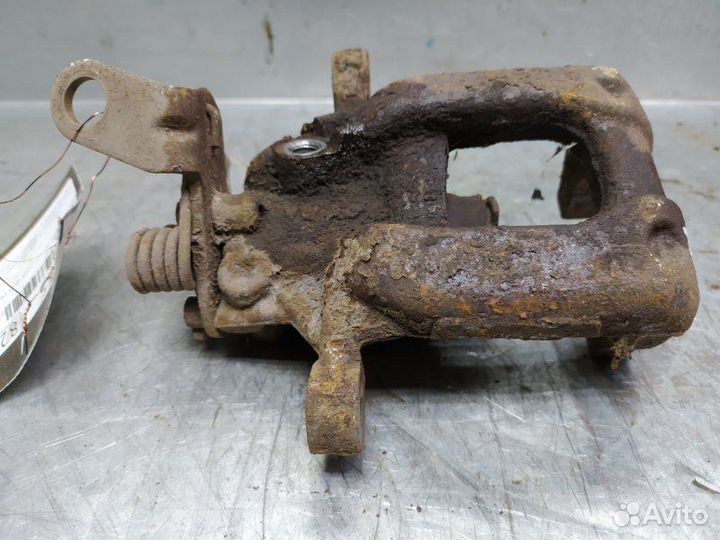 Суппорт тормозной задний левый Skoda Octavia (A5