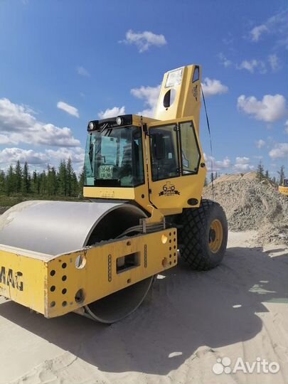 Машинист катка