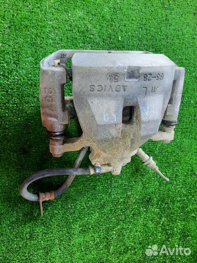 Суппорт тормозной передний левый Toyota Camry