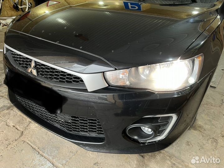 Бампер второй рестайл 2016 Mitsubishi Lancer 10