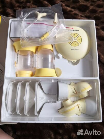 Молокоотсос medela swing maxi flex