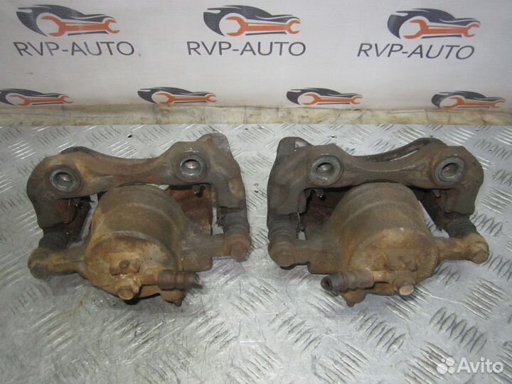 Суппорт тормозной передний Nissan Laurel C35 97-02