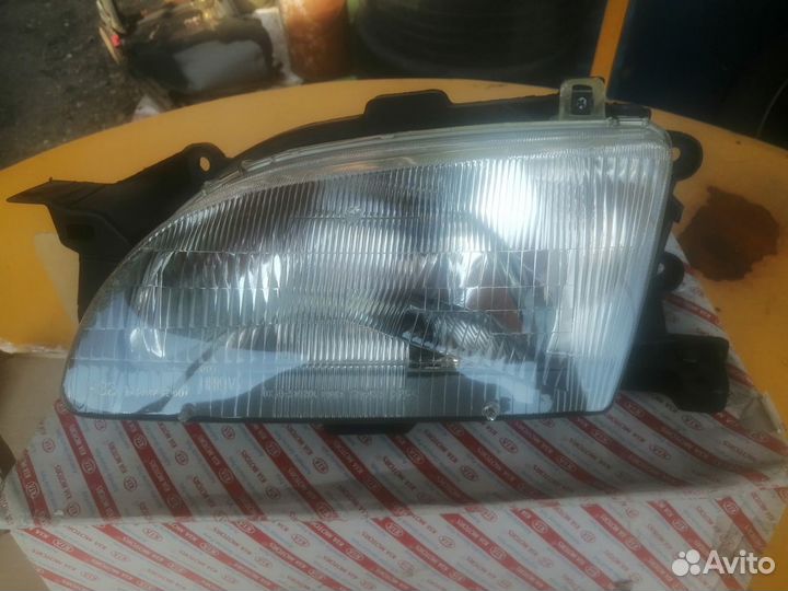 Новая оригинальная фара левая Kia Avella