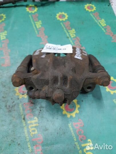 Суппорт передний левый Mitsubishi Carisma седан