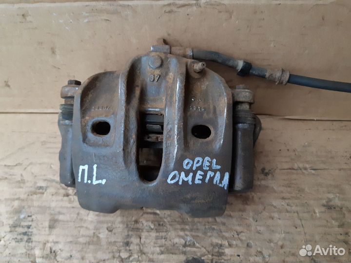 Суппорт передний Опель Омега А
