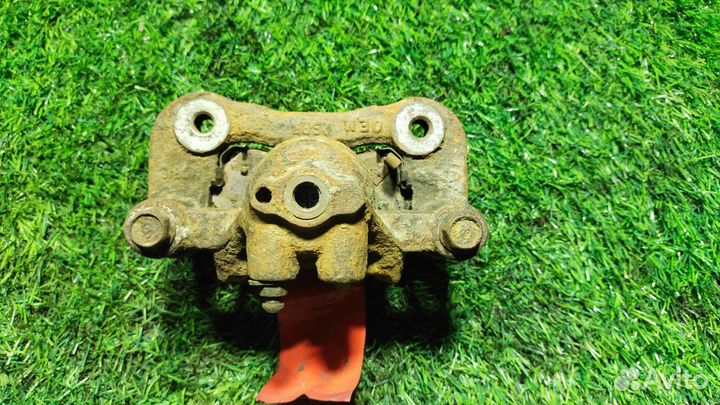 Суппорт тормозной задний левый KIA Sportage 3