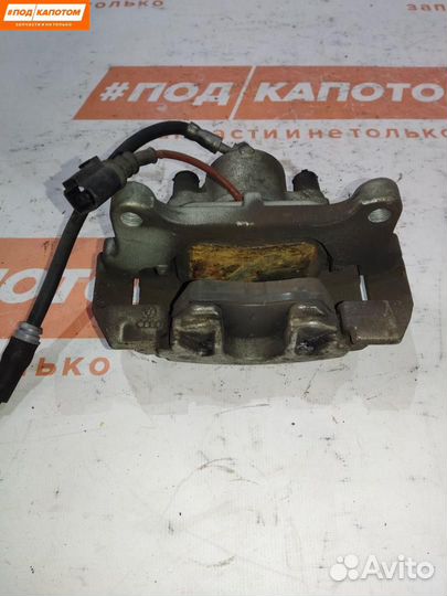 Суппорт тормозной передний левый Volkswagen Caddy