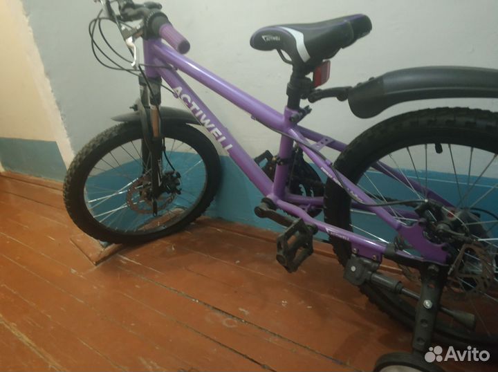 Велосипед с дополнительными колесами