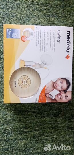 Молокоотсос medela электрический