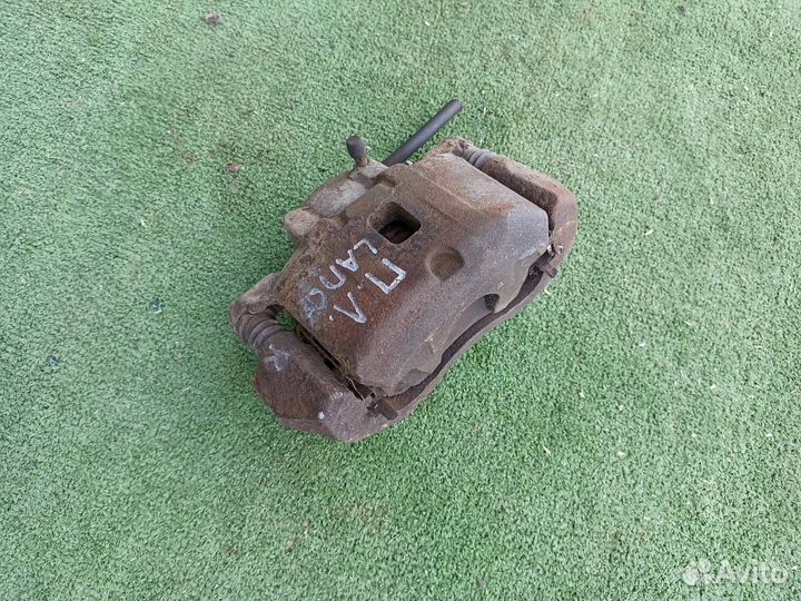 Тормозной суппорт передний левый Mitsubishi Lancer