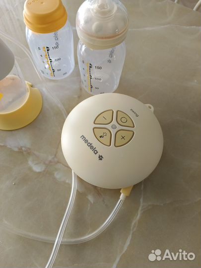 Молокоотсос medela электрический