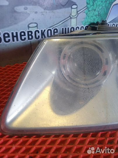 Фара передняя левая Volkswagen Touareg