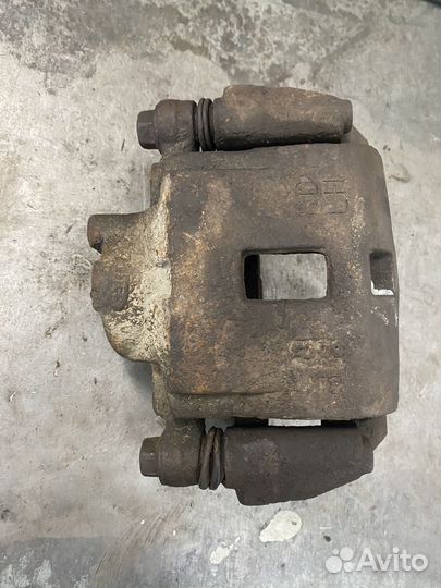 Суппорт передний левый kia spectra