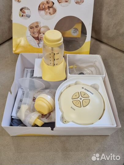 Молокоотсос medela электрический