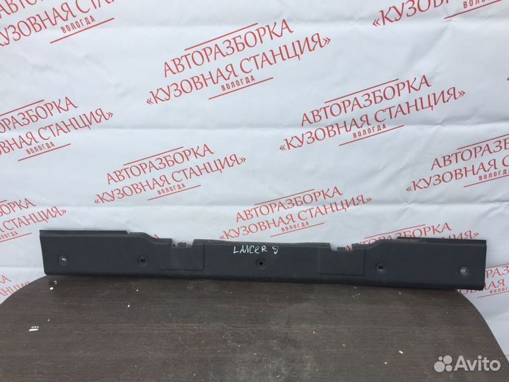Обшивка багажника передняя Mitsubishi Lancer 9