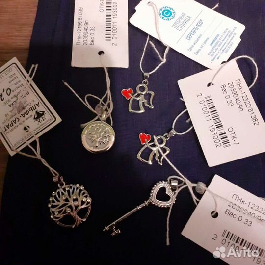 Отдам кулон новый серебро