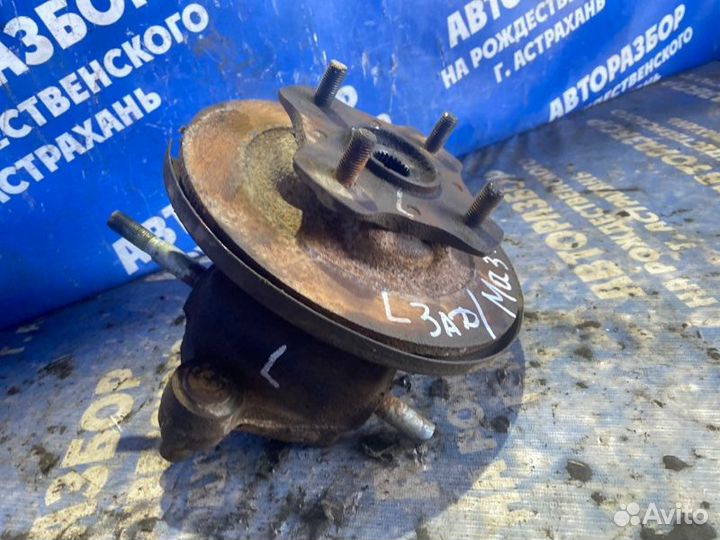 Задний левый поворотный кулак Mazda Familia седан