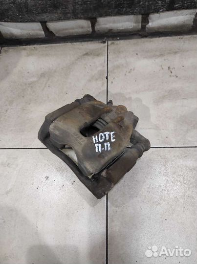 Суппорт тормозной передний правый Nissan Note E 11