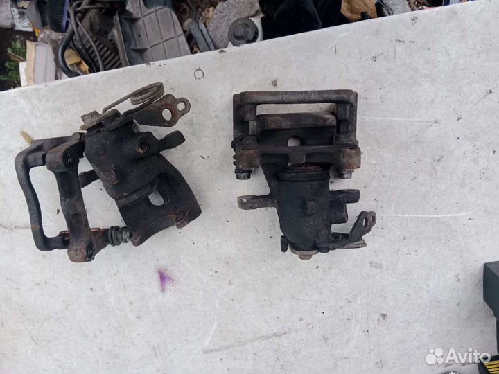 Суппорт тормозной задний левый Ford Mondeo 4