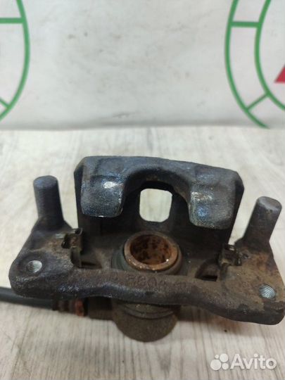 Суппорт тормозной задний левый Mitsubishi Lancer 9