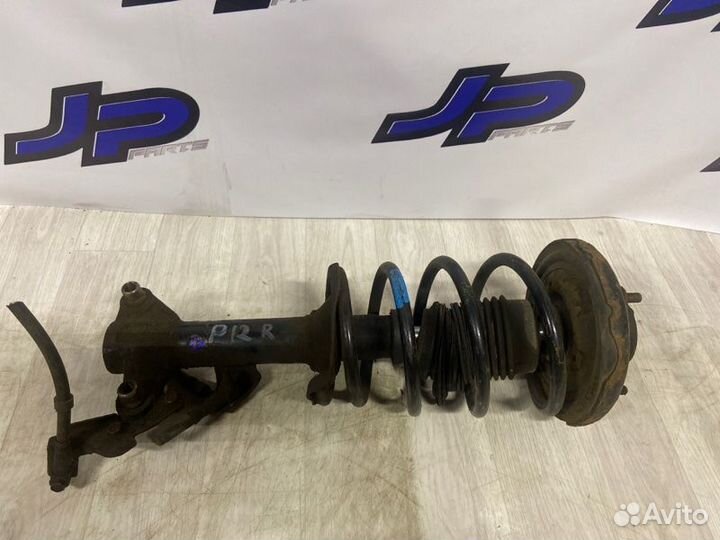 Стойка подвески передняя правая Nissan Primera P12