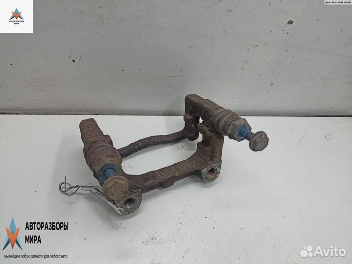 Скоба суппорта Opel Astra H/Family рест. 2005