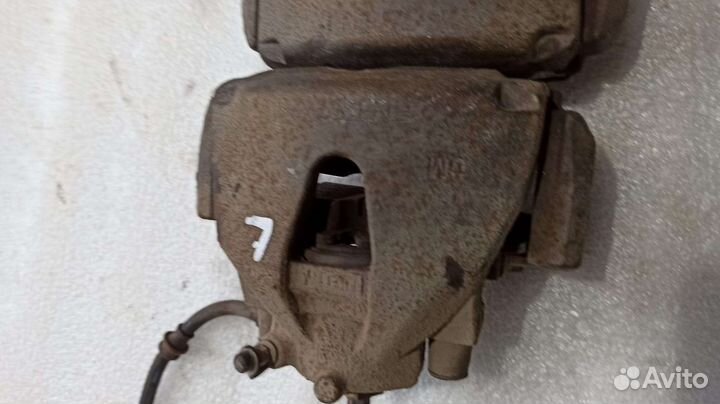 Суппорт тормозной передний Opel Astra H