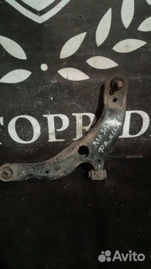 Передний правый рычаг Mazda Familia