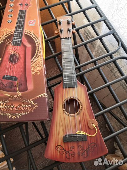 Гитара пластик 4 струны, длина 43 см