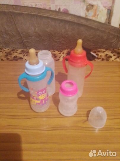 Отдам игрушки, бутылочки и сидушку на унитаз