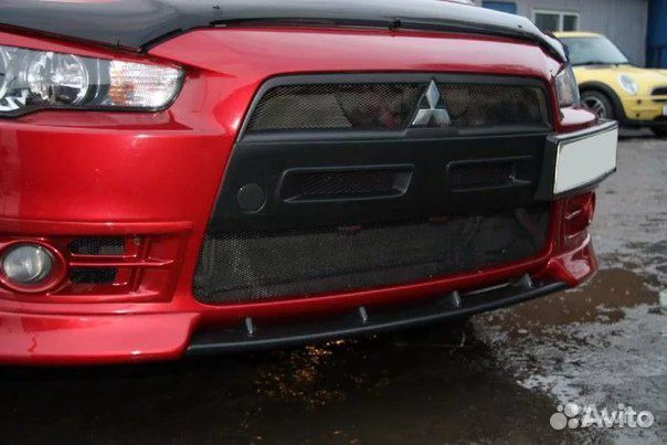 Вставка между клыками lancer 10 дорестайл