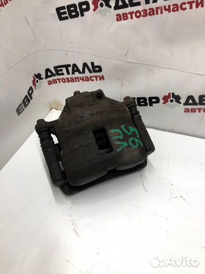 Суппорт тормозной передний левый Nissan Almera N16