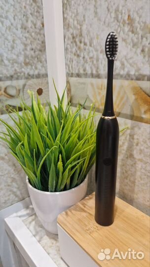 Электрическая зубная щетка