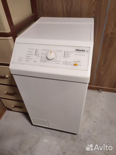 Стиральная машина с вертикальной загрузкой Miele