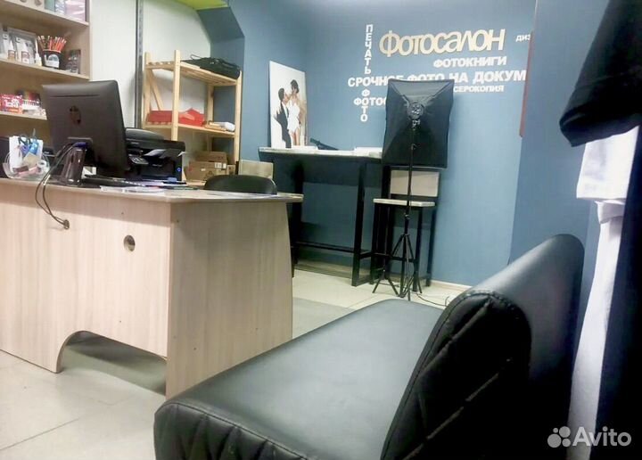 Сотрудник в фотосалон