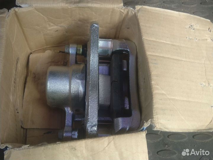 Суппорт Рекстон с 07 г задний новый левый