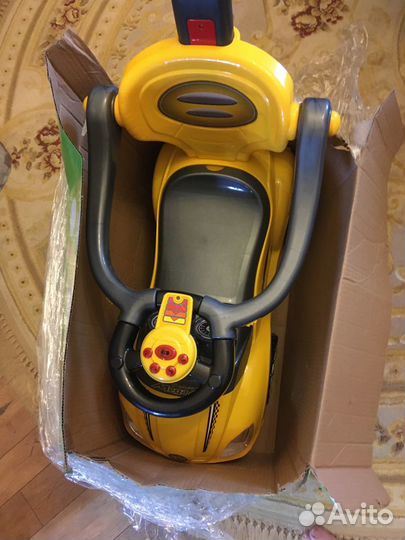 Детская машинка каталка музыкальная