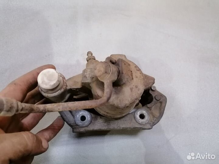 Суппорт тормозной передний левый Ford Escort 1989г