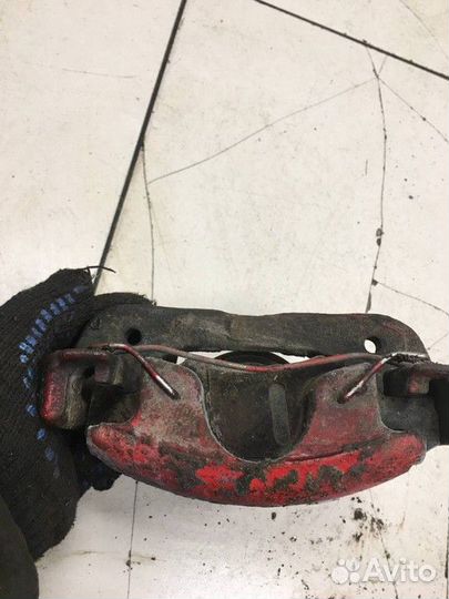 Суппорт тормозной передний левый Kia Shuma